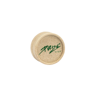 PURIZE® Hemp Grinder 55mm, valmistettu tummanvihreästä hamppukomposiitista, asetettuna luonnonmukaiseen ympäristöön.