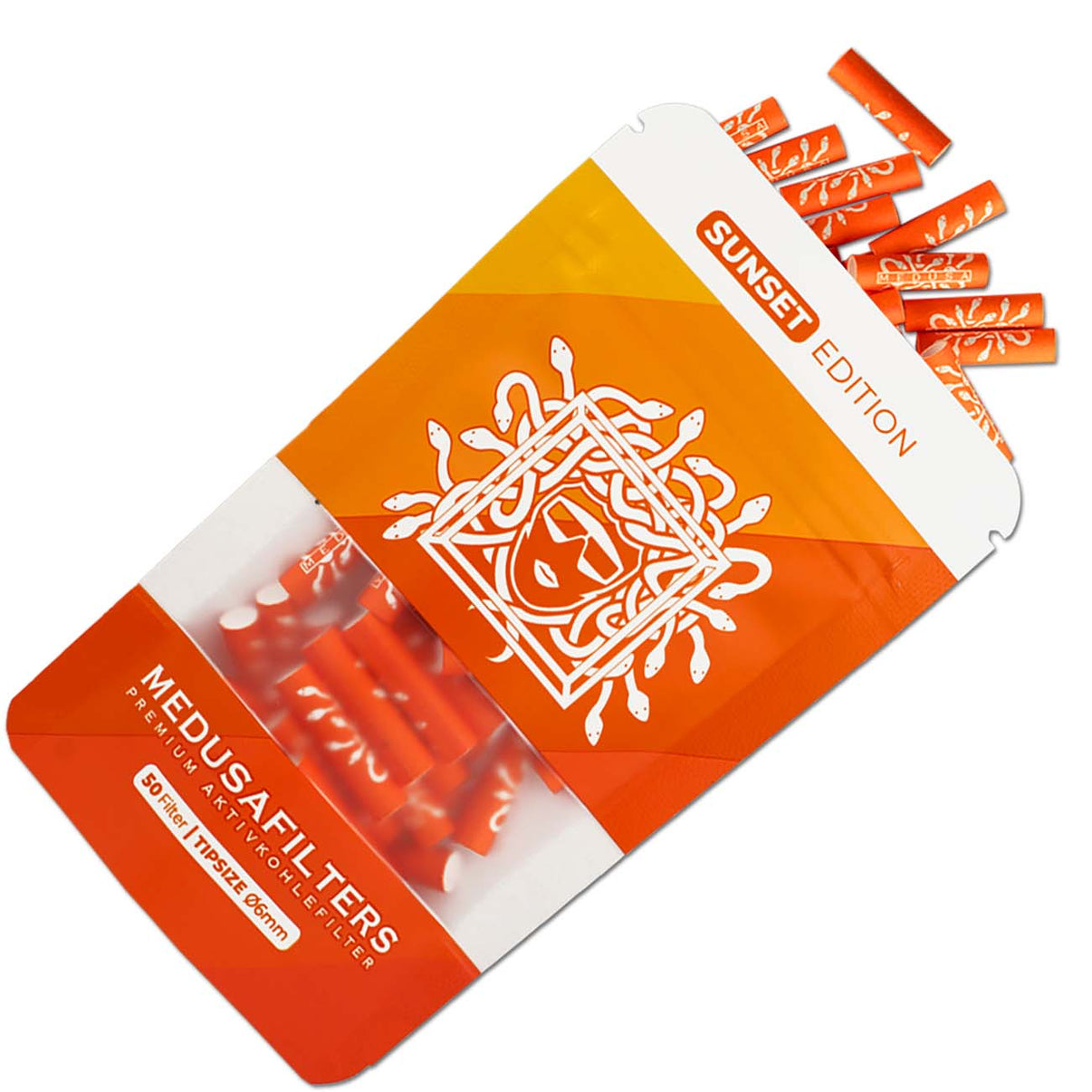 Lähikuva Medusafilters Sunset 6mm aktiivihiilisuodatinpaketista ja irtonaisista oransseista selluloosakärkifilttereistä pöydällä.