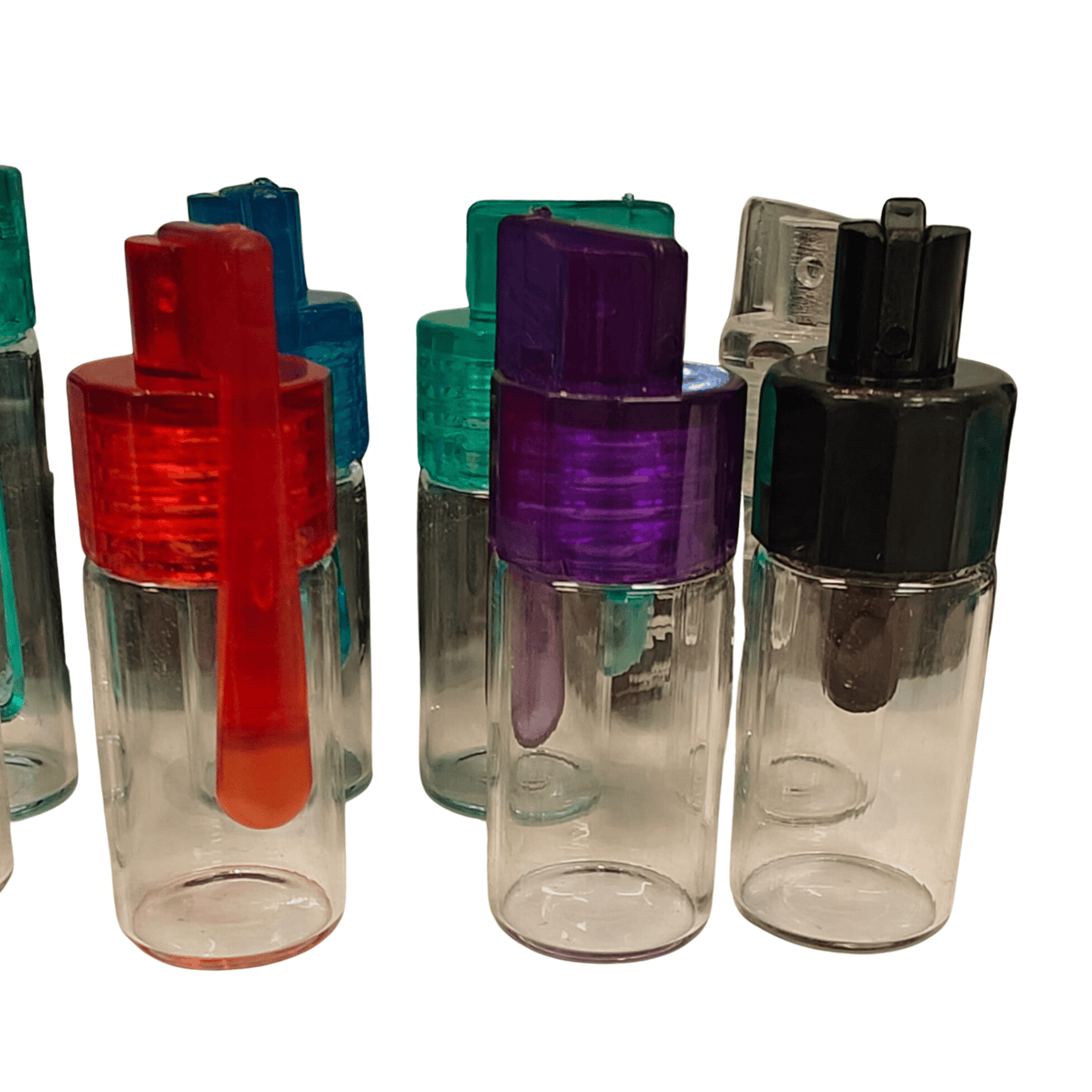 Spoon Bottle 45mm, kompakti läpinäkyvä lasipullo, jossa on hopeinen korkki ja siihen integroitu pieni metallinen annostelulusikka.