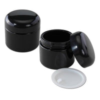 Violet Glass Jar 100ml -säilytyspurkki mustalla, puukuvioisella kierrekannella, esillä valkoisella taustalla. Ihanteellinen yrteille, mausteille, CBD-kukalle ja luonnonkosmetiikalle.